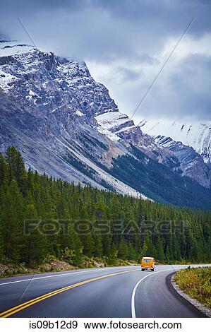 Vintage recreational vehicle driving on highway, Banff National Park, Alberta, Canada View Large Photo Image Stock Photo - Vintage recreational vehicle driving on highway, Banff National Park, Alberta, Canada. Fotosearch