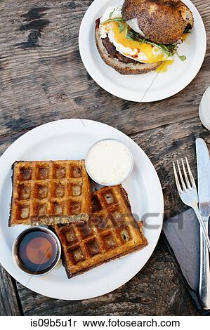 Waffles and breakfast roll on wooden table View Large Photo Image Stock Photography - Waffles and breakfast roll on wooden table. Fotosearch