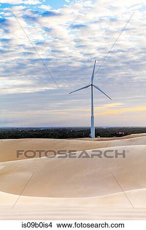 Wind turbine in desert dunes, Taiba, Ceara, Brazil View Large Photo Image Picture - Wind turbine in desert dunes, Taiba, Ceara, Brazil. Fotosearch