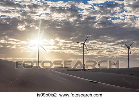 Wind turbines in desert landscape at sunset, Taiba, Ceara, Brazil View Large Photo Image Stock Image - Wind turbines in desert landscape at sunset, Taiba, Ceara, Brazil. Fotosearch