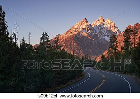 Winding road through mountain landscape, Grand Teton National Park, Wyoming, USA View Large Photo Image Stock Image - Winding road through mountain landscape, Grand Teton National Park, Wyoming, USA. Fotosearch