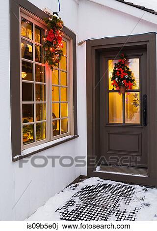 Window and brown front entrance door with Christmas lights and decorations, Quebec, Canada View Large Photo Image Stock Image - Window and brown front entrance door with Christmas lights and decorations, Quebec, Canada. Fotosearch
