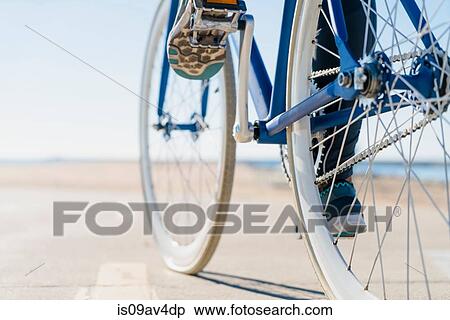 Woman cycling, low section, close-up View Large Photo Image Stock Photography - Woman cycling, low section, close-up. Fotosearch