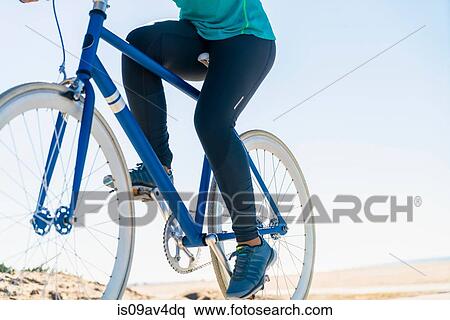 Woman cycling, low section, close-up View Large Photo Image Stock Photography - Woman cycling, low section, close-up. Fotosearch