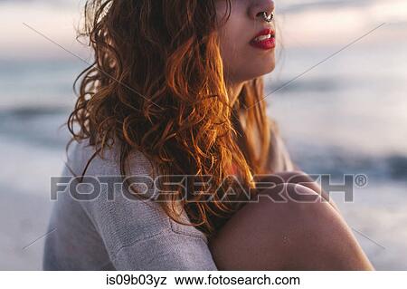 Woman daydreaming on beach View Large Photo Image Stock Photo - Woman daydreaming on beach. Fotosearch