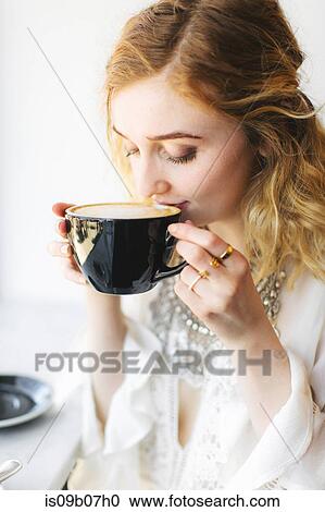Woman drinking coffee View Large Photo Image Stock Image - Woman drinking coffee. Fotosearch