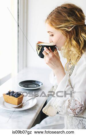 Woman drinking coffee View Large Photo Image Stock Photo - Woman drinking coffee. Fotosearch