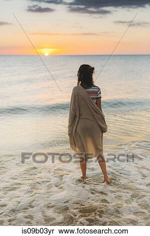 Stock Photography - Woman enjoying beach. Fotosearch