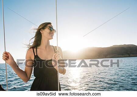 Woman enjoying view on sailboat, San Diego Bay, California, USA View Large Photo Image Stock Image - Woman enjoying view on sailboat, San Diego Bay, California, USA. Fotosearch
