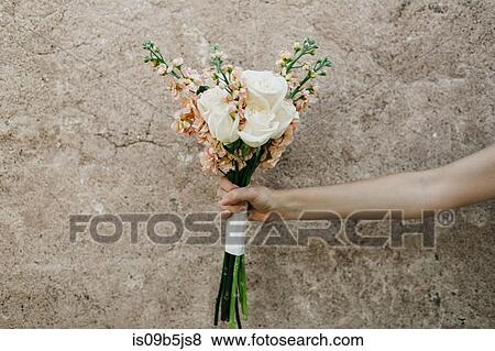 Woman holding bouquet of flowers, close-up View Large Photo Image Stock Photo - Woman holding bouquet of flowers, close-up. Fotosearch