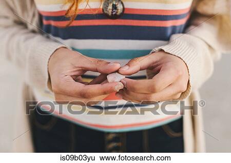 Woman holding seashell View Large Photo Image Stock Photograph - Woman holding seashell. Fotosearch