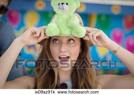 Woman holding teddy bear, pulling face, Coney island, Brooklyn, New York, USA View Large Photo Image Stock Image - Woman holding teddy bear, pulling face, Coney island, Brooklyn, New York, USA. Fotosearch