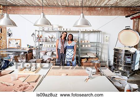 Woman in workshop looking at camera smiling View Large Photo Image Stock Photo - Woman in workshop looking at camera smiling. Fotosearch