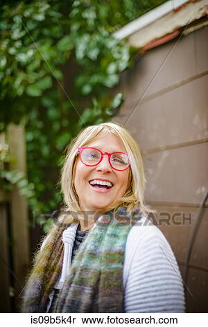 Woman laughing by garden shed View Large Photo Image Stock Photography - Woman laughing by garden shed. Fotosearch
