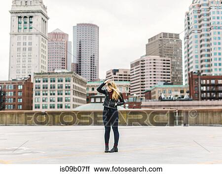 Woman on rooftop, Boston, Massachusetts, USA View Large Photo Image Stock Image - Woman on rooftop, Boston, Massachusetts, USA. Fotosearch