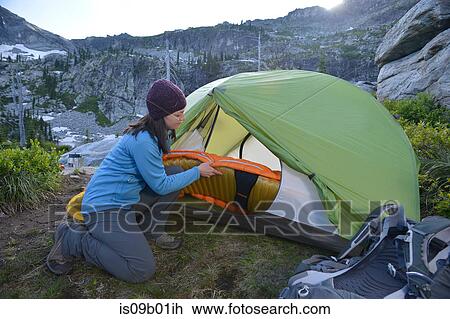 Woman putting sleeping bag in tent at sunset, Fault Lake, Selkirk Mountains, Idaho View Large Photo Image Stock Image - Woman putting sleeping bag in tent at sunset, Fault Lake, Selkirk Mountains, Idaho. Fotosearch