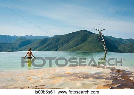 Woman relaxing in thermal spring, Hierve el Agua, Oaxaca, Mexico. View Large Photo Image Stock Image - Woman relaxing in thermal spring, Hierve el Agua, Oaxaca, Mexico.. Fotosearch