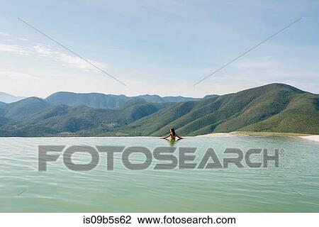 Woman relaxing in thermal spring, Hierve el Agua, Oaxaca, Mexico. View Large Photo Image Stock Image - Woman relaxing in thermal spring, Hierve el Agua, Oaxaca, Mexico.. Fotosearch