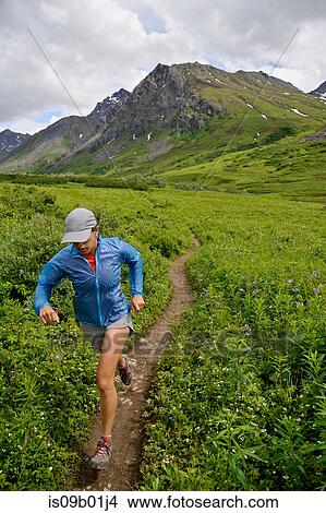 Woman running the Gold Mint Trail, Talkeetna Mountains near Hatcher Pass, Alaska, USA View Large Photo Image Picture - Woman running the Gold Mint Trail, Talkeetna Mountains near Hatcher Pass, Alaska, USA. Fotosearch