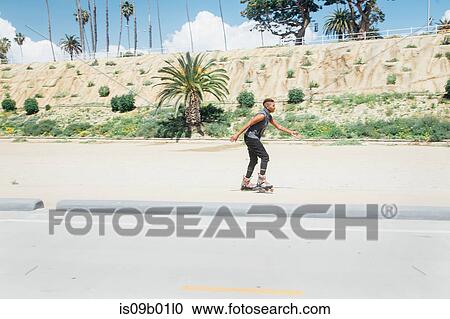 Woman skating on rollerblades View Large Photo Image Stock Image - Woman skating on rollerblades. Fotosearch