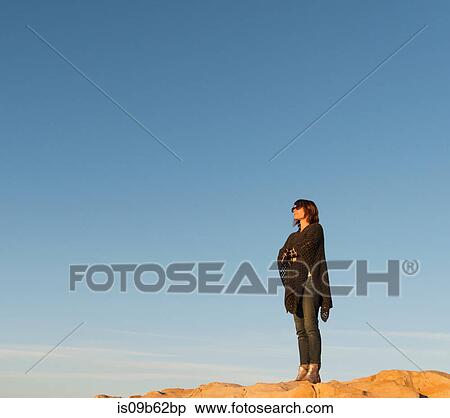 Woman standing on rock, looking at view, Laguna Beach, California, United States, North America View Large Photo Image Stock Photography - Woman standing on rock, looking at view, Laguna Beach, California, United States, North America. Fotosearch