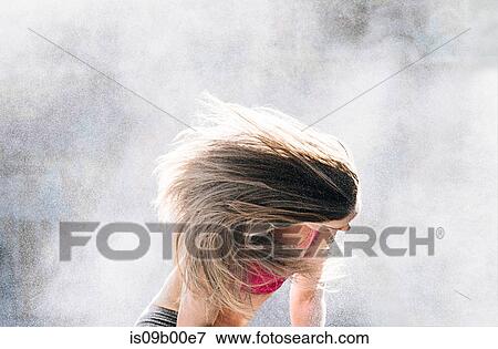 Woman throwing powder covered hair back View Large Photo Image Stock Photo - Woman throwing powder covered hair back. Fotosearch