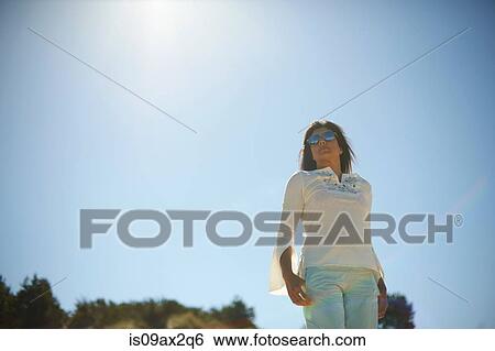 Woman under hot sun View Large Photo Image Stock Photograph - Woman under hot sun. Fotosearch