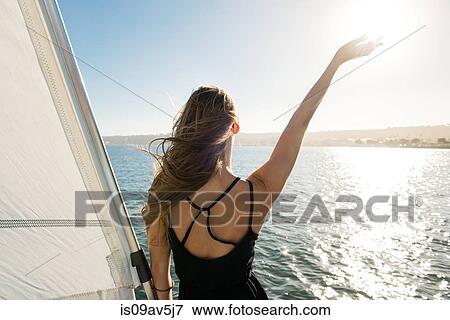 Woman waving on sailboat, San Diego Bay, California, USA View Large Photo Image Stock Photo - Woman waving on sailboat, San Diego Bay, California, USA. Fotosearch