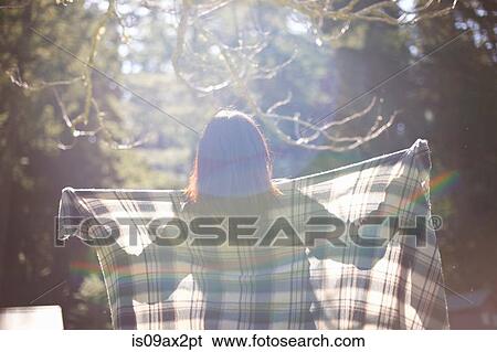 Woman with checkered shawl in forest View Large Photo Image Stock Photograph - Woman with checkered shawl in forest. Fotosearch