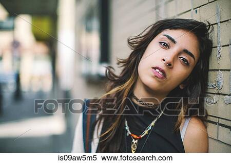 Woman with nose ring leaning against wall looking at camera, Boston, Massachusetts, USA View Large Photo Image Stock Photography - Woman with nose ring leaning against wall looking at camera, Boston, Massachusetts, USA. Fotosearch