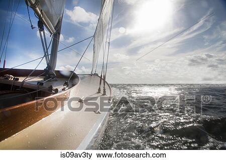 Yacht on ocean in sunlight View Large Photo Image Stock Photo - Yacht on ocean in sunlight. Fotosearch