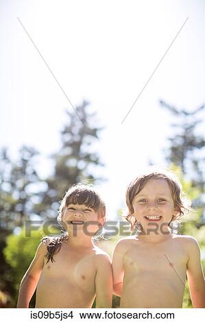 Picture - Young boy and girl, outdoors, smiling. Fotosearch