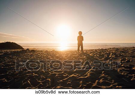 Young boy standing on beach, Buellton, California, USA View Large Photo Image Stock Image - Young boy standing on beach, Buellton, California, USA. Fotosearch