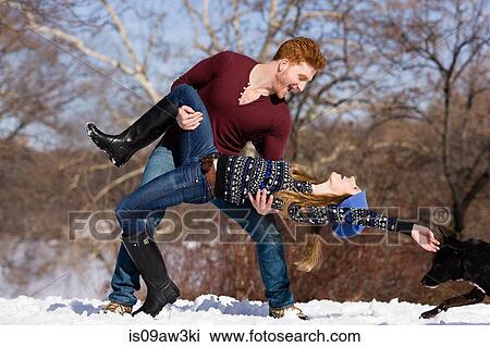 Young couple fooling around in snowy Central Park, New York, USA View Large Photo Image Stock Image - Young couple fooling around in snowy Central Park, New York, USA. Fotosearch