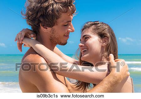 Young couple hugging on beach, Taiba, Ceara, Brazil View Large Photo Image Stock Photograph - Young couple hugging on beach, Taiba, Ceara, Brazil. Fotosearch