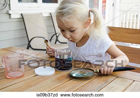 Young girl doing science experiment View Large Photo Image Stock Image - Young girl doing science experiment. Fotosearch