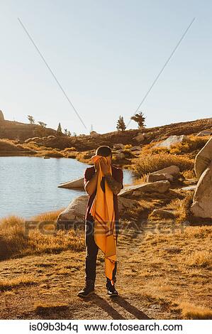 Young male hiker by lake drying face with towel, Mineral King, Sequoia National Park, California, USA View Large Photo Image Stock Photography - Young male hiker by lake drying face with towel, Mineral King, Sequoia National Park, California, USA. Fotosearch