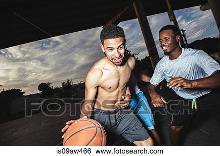 Young men playing basket ball smiling View Large Photo Image Stock Photograph - Young men playing basket ball smiling. Fotosearch