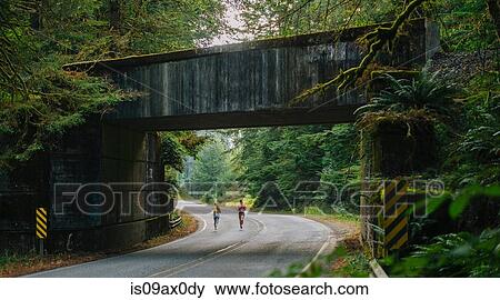 Young woman and teenage girl running along rural road, rear view View Large Photo Image Stock Photo - Young woman and teenage girl running along rural road, rear view. Fotosearch