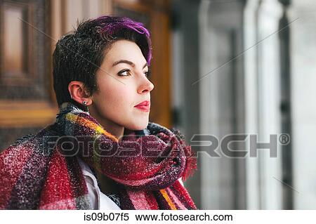Young woman looking out of window with pensive expression View Large Photo Image Stock Photography - Young woman looking out of window with pensive expression. Fotosearch