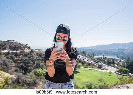 Young woman photographing Hollywood sign, Los Angeles, California, USA View Large Photo Image Stock Image - Young woman photographing Hollywood sign, Los Angeles, California, USA. Fotosearch