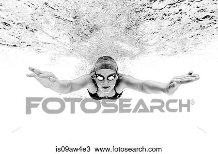 Young woman swimming underwater View Large Photo Image Stock Image - Young woman swimming underwater. Fotosearch