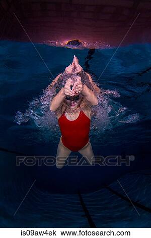 Young woman swimming underwater View Large Photo Image Stock Image - Young woman swimming underwater. Fotosearch