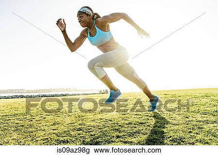 Young woman training, sprinting at coast, downtown San Diego, California, USA View Large Photo Image Stock Image - Young woman training, sprinting at coast, downtown San Diego, California, USA. Fotosearch