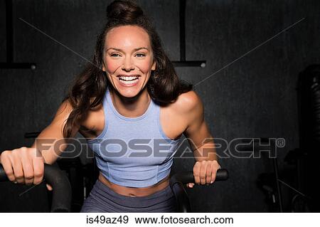 Young woman working out in cross fit gym View Large Photo Image Stock Photo - Young woman working out in cross fit gym. Fotosearch