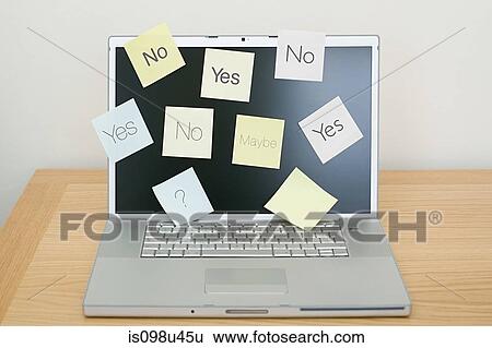 Stock Photograph - Adhesive notes on laptop. Fotosearch