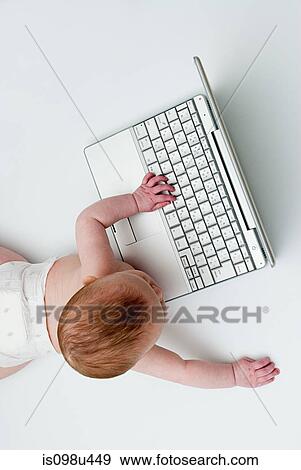Baby with a laptop View Large Photo Image Stock Photo - Baby with a laptop. Fotosearch