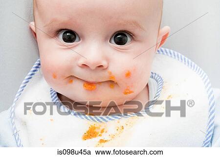 Baby with food on his face View Large Photo Image Stock Image - Baby with food on his face. Fotosearch