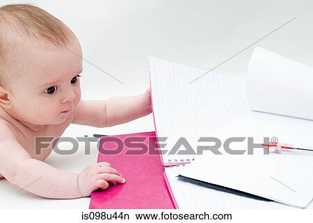 Baby with notebooks View Large Photo Image Picture - Baby with notebooks. Fotosearch