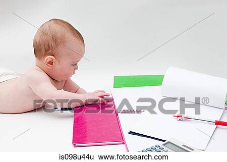 Baby with notebooks View Large Photo Image Stock Photograph - Baby with notebooks. Fotosearch